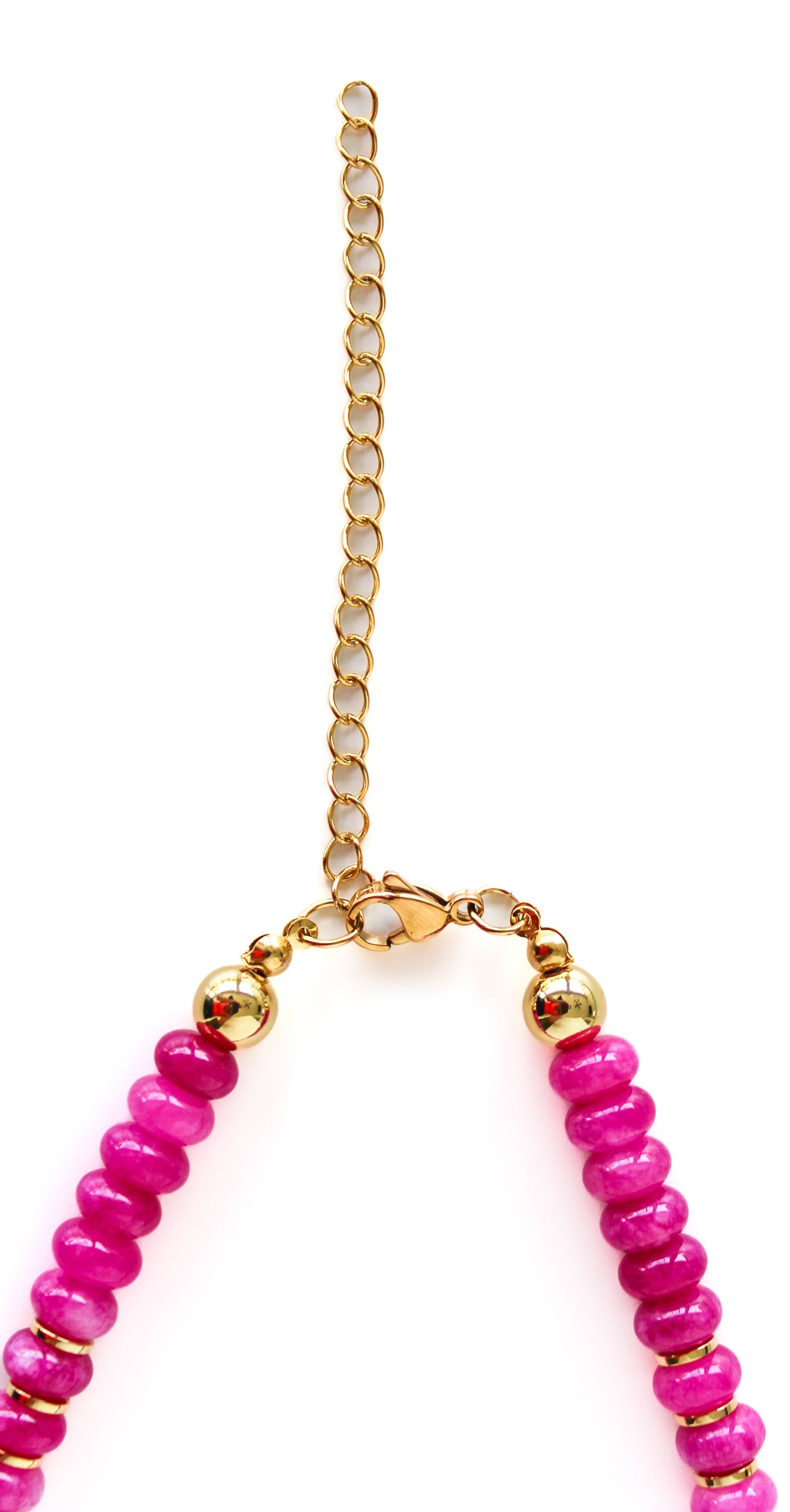 a pink and gold necklace on a gold chain